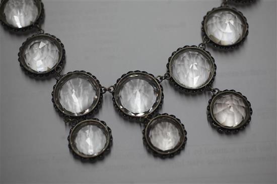 A mid to late 19th century white metal and rock crystal drop necklace and pair of matching earrings, 40cm.